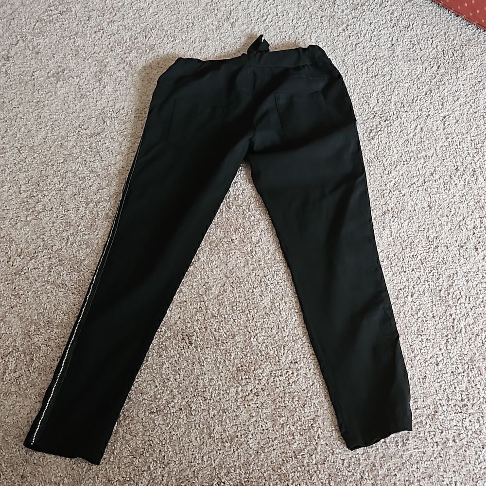 Black tie waist pants with line of sparkly stones going down each pants leg